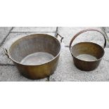 A VERY LARGE TWIN HANDLED BRASS PRESERVE PAN 44cm diameter, and another brass preserve pan with iron