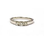 A PLATINUM AND DIAMOND PRINCESS CUT THREE STONE RING shanked marked 950, ring size O, weight 4.