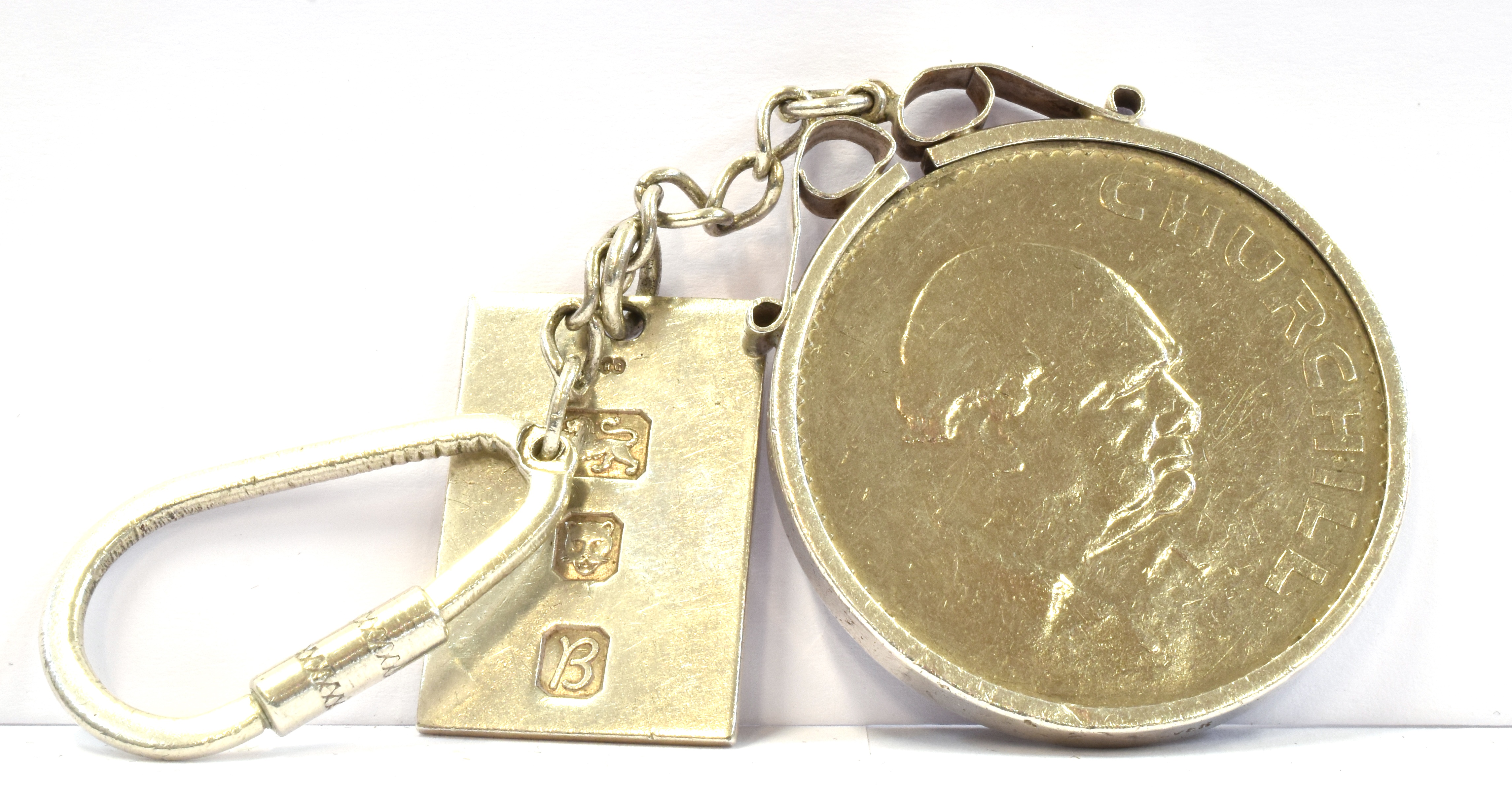 A SILVER FOB and silver mounted 1965 Churchill crown