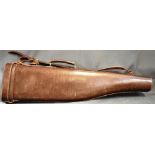 A BROWN LEATHER 'LEG OF MUTTON' GUN CASE complete with carrying handle and shoulder strap, 81.5cm