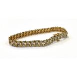 A 9CT GOLD DIAMOND TENNIS BRACELET the bracelet comprising a double row of 80 round cut diamonds