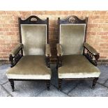 PAIR OF EBONISED ARMCHAIRS raised on circular legs with casters, H 96cm Condition Report : Wear