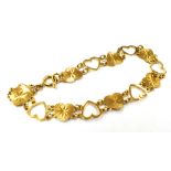 A MARKED 9CT GOLD HEART LINK BRACELET the bracelet measuring approx. 17 ½cm in length and 1cm in