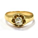 AN OLD CUT DIAMOND SET 18CT GOLD RING the buttercup claw set front comprising a cushion shaped old