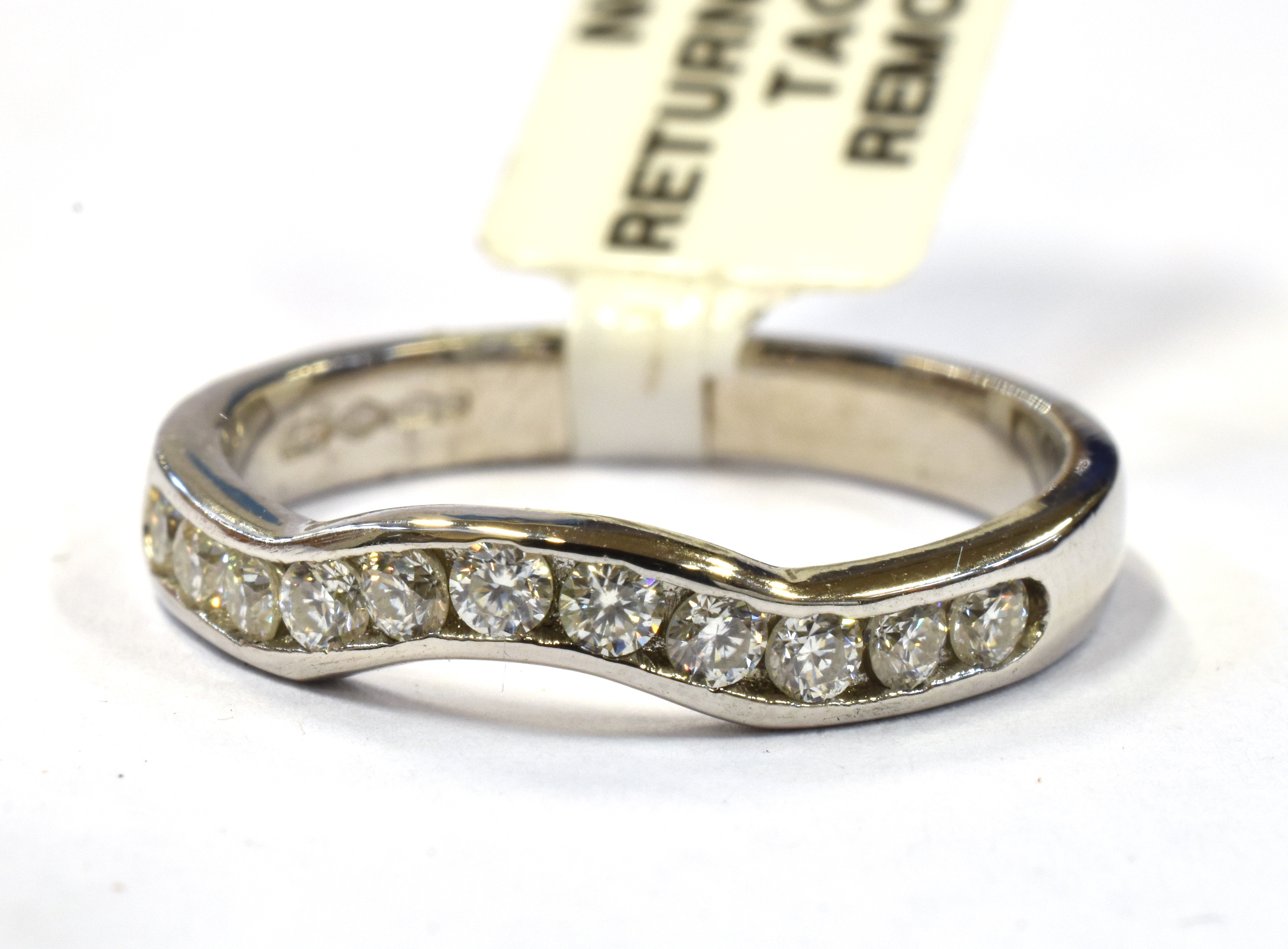 A PLATINUM AND MOISSANITE WISHBONE RING boxed and certified, marked 950 Birmingham, ring size L,