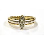 A 9CT BI-COLOURED DIAMOND RING the navette set, with three round cut diamonds in white gold, the