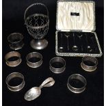A COLLECTION OF SILVER COMPRISING of six matching napkin rings, a cased set of six coffee bean