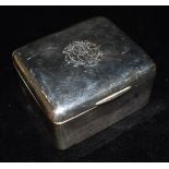 AN EDWARDIAN SILVER SQUARE BOX OF PLAIN FORM With an engraved monogram to the lid, inlaid with wood,