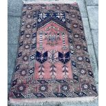 A RED GROUND PRAYER RUG 118cm x 183cm Condition Report : faded, but no other condition issues