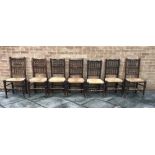 SEVEN MATCHING OAK AND RUSH SEATED CHAIRS, the largest H 98cm, the smallest H 92cm