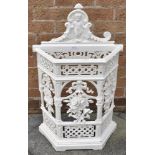 A VICTORIAN CAST IRON STICK STAND of canted rectangular form, the pierced front with floral