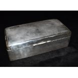 A SILVER RECTANGULAR BOX The box inset with hard board inlay forming a double compartment, the lid