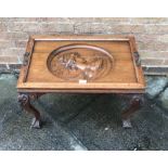 AN OAK OCCASIONAL TABLE of rectangular form with an Art Nouveau style decoration and a female's head