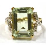 A 9CT GOLD AQUAMARINE COCKTAIL RING the step cut aquamarine measuring approx. 1.4cm by 1cm, with