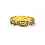 AN 18CT GOLD ETERNITY RING the ring featuring a white gold fancy pattern centrally set, ring
