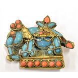 AN EARLY 20TH CENTURY ASIAN TURQUOISE CORAL AND BRASS METAL ELEPHANT BROOCH fitted with a c clasp