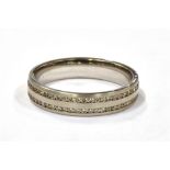 AN 18CT WHITE GOLD, CHANNEL SET DIAMOND ETERNITY RING the ring marked 750 and set with two rows of