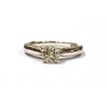 AN 18CT WHITE GOLD 1 CARAT DIAMOND RING the principle round cut diamond measuring 5mm in diameter