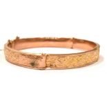 A 9CT ROSE GOLD GEORGE V BANGLE the half patterned bangle measures approx. 5.7cm in diameter and