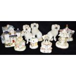 TWO PAIRS OF STAFFORDSHIRE SPANIELS and eight Staffordshire cottages/pastille burners