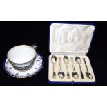 A GEORGE V ROYAL WORCESTER SILVER HELD CUP WITH SAUCER The silver with open work pattern detail