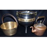 A VICTOIRAN BRASS AND IRON COAL BUCKET of cauldron form, with brass ring handles and three prong