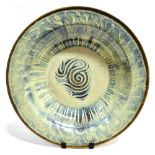 A LARGE CONTEMPORARY STUDIO POTTERY CHARGER with swirl decoration, 58cm diameter Condition