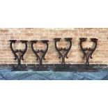 PAIR OF CAST IRON TABLE SUPPORTS both on wooden bases, H 81cm, together with a matching pair,