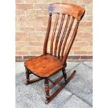 AN ELM ROCKING CHAIR with slat back, H 94cm