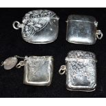 A COLLECTION OF SILVER VESTA CASES comprising three Edwardian (1906, 1908, 1908) and a George V half