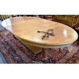 AN OAK EXTENDING DINING TABLE with two extra leaves H 72cm x D 146cm x Length 189cm