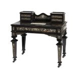 IN THE STYLE OF POGLIANI, AN ITALIAN EBONY AND INLAID WRITING DESK the super structure having a