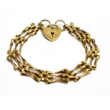 A 9CT GOLD VINTAGE HEART PADLOCK THREE GATE BRACELET The bracelet measuring approx. 16cm in