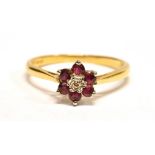 AN 18CT GOLD, DIAMOND AND RUBY FLOWER RING Hallmarked for London, ring size P ½, weight approx. 2.