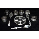 A COLLECTION OF SILVER comprising six assorted napkin rings, three teaspoons and a 1694-1994