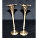A PAIR OF WEIGHTED SILVER TRUMPET VASES Hallmarked for Birmingham, standing approx. 20cm tall.