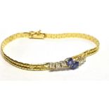AN 18CT GOLD SAPPHIRE AND DIAMOND BRACELET the bracelet centrally set with two royal blue