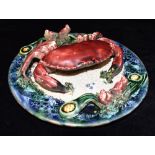A PALISSY STYLE WALL PLAQUE naturalistically modelled with a crab, 24.5cm diameter Condition
