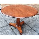 A MAHOGANY BREAKFAST TABLE the top, Diameter 100cm, raised on a central octagonal column to