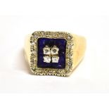 AN ART DECO DESIGN DIAMOND AND BLUE ENAMEL RING The signet style square head with a square of four