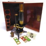 A MONOCULAR MICROSCOPE BY SWIFT, LONDON the lacquered brass and japanned body impressed 'SWIFT & SON