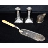 A COLLECTION OF SILVER comprising a pair of George V silver dwarf candlesticks, hallmarked for