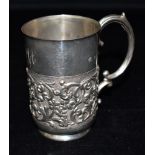 A VICTORIAN SILVER CUP the cup half embossed with flowers and scrolls with monogrammed initials to