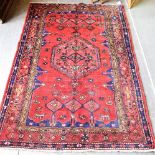 A RED GROUND ZANJAN RUG with central medallion and stylised animal decoration, 203cm x 133cm