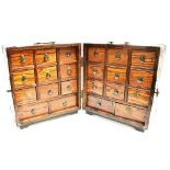 ORIENTAL ROSEWOOD FOLDING BANK OF DRAWERS with each side having three rows of three short drawers