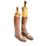 PAIR OF BROWN LEATHER RIDING BOOTS approximately size 9, with trees