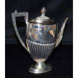 A VICTORIAN SILVER TEAPOT the teapot with fluted detail to belly, spout and lid, ebonised angular