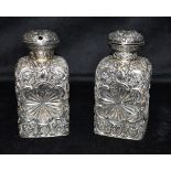 A PAIR OF LARGE WHITE METAL OVERLAY CUT GLASS PERFUME BOTTLES Height 13.7 cm Condition Report : No