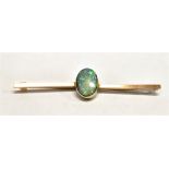 AN OPAL DOUBLET SET BAR BROOCH The single opal centrally set measuring 1.2cm x 0.8cm on a strip