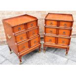 PAIR OF LOW MAHOGANY THREE TIERED GRADUATING CABINETS with each tier having a single drawer and with